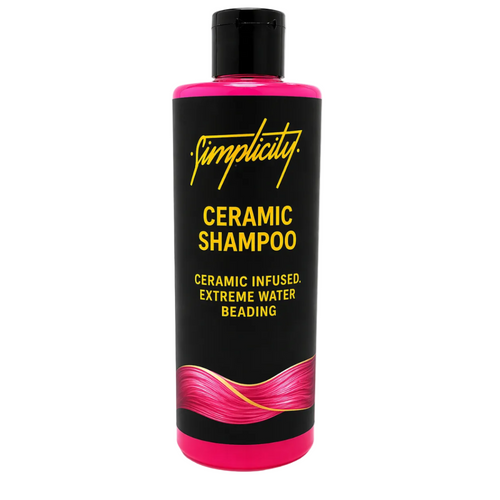 Shampoo bottle with black and pink design on a white background